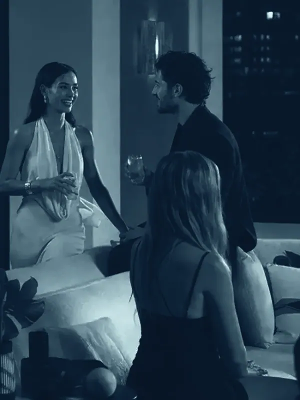 Talent and host in conversation on a rooftop set at night during a hospitality content shoot